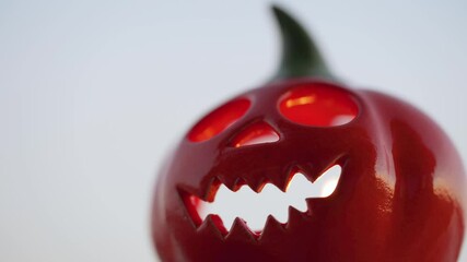 Halloween Jack-o-Lantern with burning candle inside. Halloween symbol. Autumn All Saints Day.