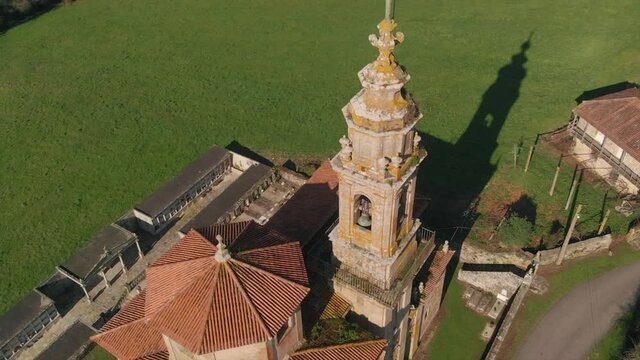 Aerial View Of The Ancient Parish Church Of Nosa Se&ntilde;ora dos Desamparados In Abades, Spain - descending drone shot