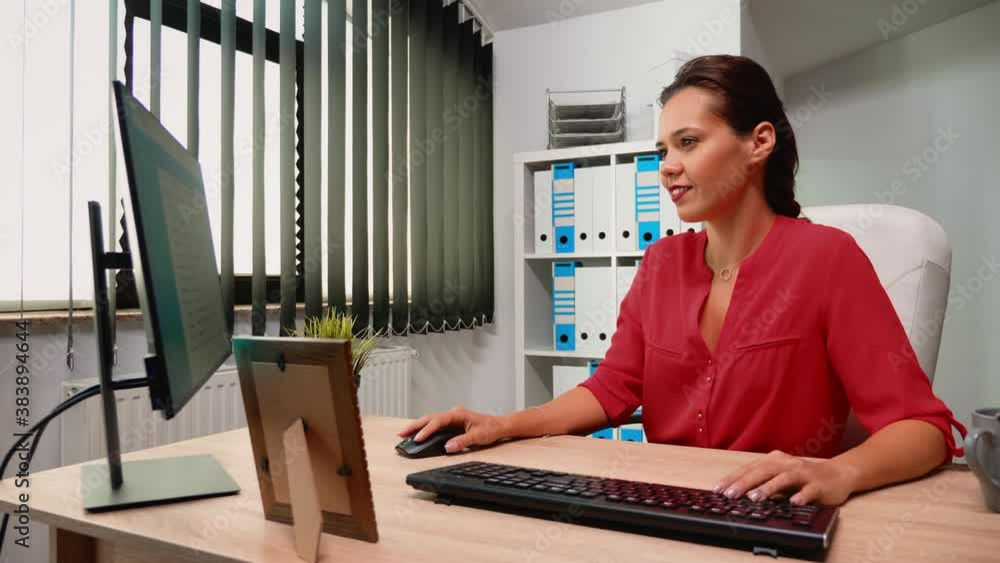 Poster hispanic woman employee checking appointments on computer sitting in modern office room. entrepreneu