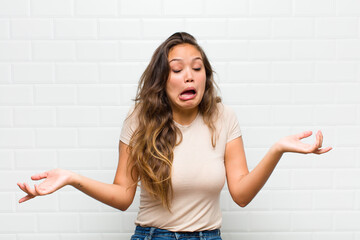 shrugging with a dumb, crazy, confused, puzzled expression, feeling annoyed and clueless