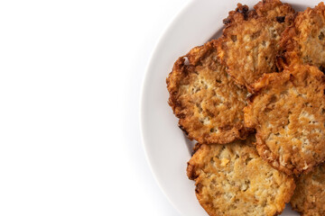 Traditional Jewish latkes or potato pancakes isolated on white background