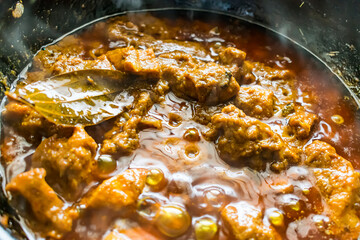home made making spicy chicken in indian style close view  looking awesome in frying pan.
- 383899402