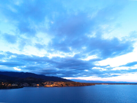 Collioure bay viewed from air above the sea at sunrise