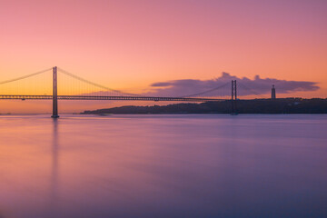 Sunrise by the 25 de Abril Bridge in Lisbon