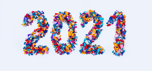 Colorful 2021 date figures confetti bright blue pink orange yellow white background
