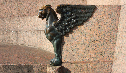 Bronze griffin sculpture at the Quay with Sphinxes in Saint Petersburg, Russia. Russian city...