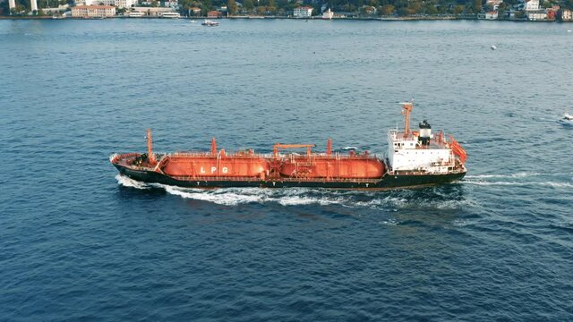 Oil tanker (LPG or chemical) is floating at sea oil port terminal. Oil and gas petrochemical tanker offshore in open sea. Refinery industry cargo ship. Aerial view