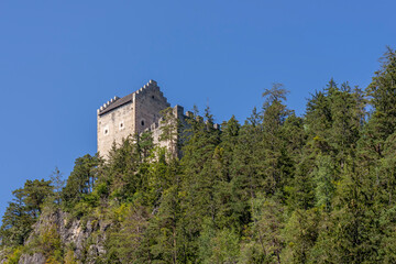 Fototapeta na wymiar The ruins of Kronburg Castle are located on a steep rock face between Zams and Schönwies in the Tyrolean Oberland, Austria