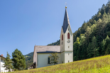 Fototapeta na wymiar The Wallfahrtskirche Kronburg church near Kroburg castle, Tyrol, Austria, on a sunny day