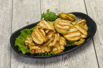 Grilled eggplant slices served basil