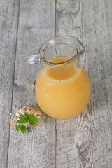 Dietary vegetarian oats milk over wooden