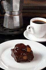 Choux with chocolate ganache and coffee cup