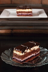 Layer cake with fruit and cream fillings decorated chocolate icing