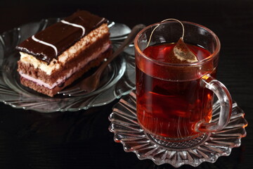 Cup of tea and cake with fruit and cream fillings