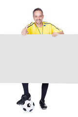 Happy Coach Holding Placard And Football