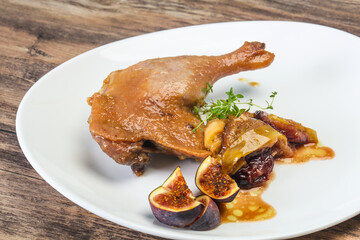 Roasted. duck. leg with plum and apple