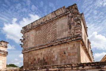 A beautifully decorated building from the Quadrangle of the Nuns in the archaeological site of Uxmal, Yucatan Peninsula, Mexico