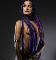 Sexy horsewoman topless with bow and arrows shot