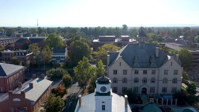 Aerial Reverse And Boom Down To Confederate Soldier Memorial To View Of Civil War Museum, Courthouse And Winchester, Virginia.