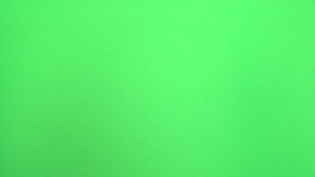 High five! Greetings from a man's hand on a green background or chromakey