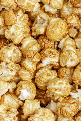 Popcorn Pattern. A pile of popcorn. Sweets. Popcorn Pattern. Caramel popcorn textured background. Food, cinema, movie. Top view. 