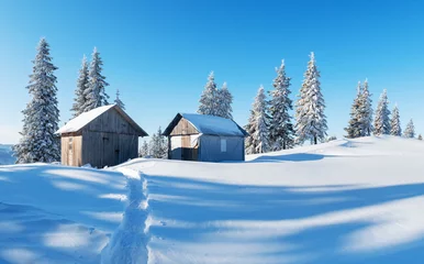 Fotobehang Fantastic winter landscape with wooden house in snowy mountains. Christmas holiday concept © Ivan Kmit