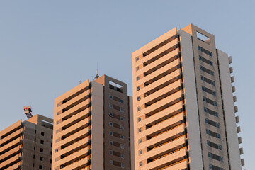 different photos of a group of gray buildings on a clear day