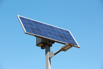 Solar battery against the sky. Solar battery and diode lamp