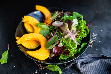 healthy pumpkin salad lettuce leaves organic ingredient eat cook snack meal on the table tasty serving size portion top view copy space for text food background rustic keto or paleo diet