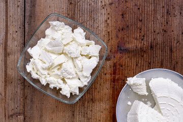 Ricotta cheese on wood background
