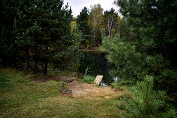 village beach and bridge by the pond