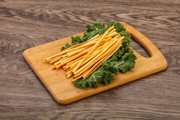 Chechel cheese sticks over board