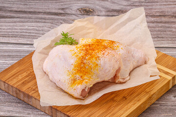 Raw chicken thigh with spices