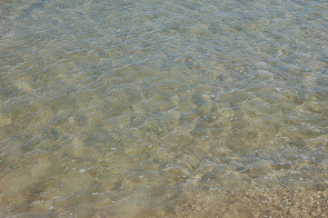 clear water, sea, sand, clean bottom, ripples on the surface
