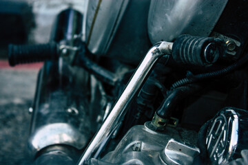 Closeup of a motorcycle parked in the streets of the city center of the metropolitan area
