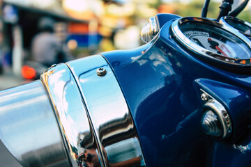 Closeup of a motorcycle parked in the streets of the city center of the metropolitan area
