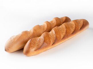  two wheat baguettes on a white background