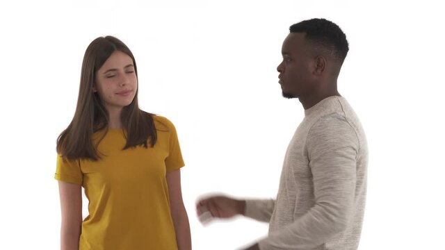 Aggressive african man trying to choke his scared Caucasian girlfriend. Family violence concept. Isolated on white background