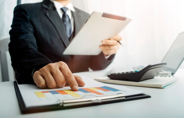 businesswoman hand using smart phone, tablet payments and holding credit card online shopping, omni channel, digital tablet docking keyboard computer at office in sun light