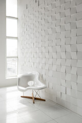 modern futuristic contemporary interior in extra white color with stylish chair and decorative wall