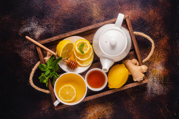 Obraz na płótnie Canvas Green tea with lemon honey, ginger and mint.