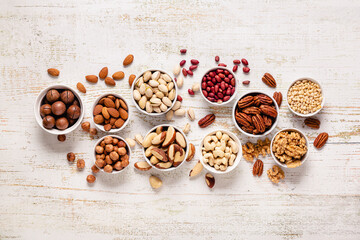Fototapeta na wymiar Various Nuts in bowls.
