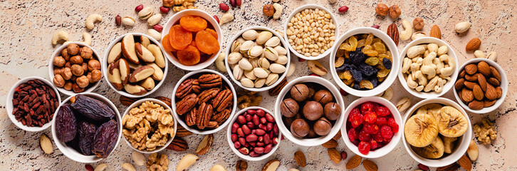 Nuts and dried fruits assortment. - obrazy, fototapety, plakaty