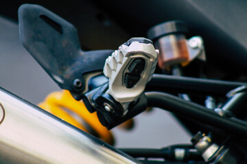 Closeup of a motorcycle parked in the streets of the city center of the metropolitan area
