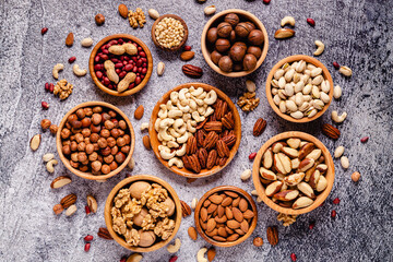 Fototapeta na wymiar Various Nuts in wooden bowls.