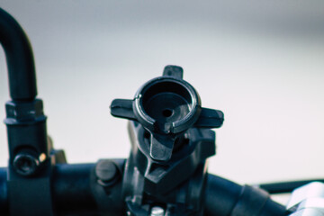Closeup of a motorcycle parked in the streets of the city center of the metropolitan area
