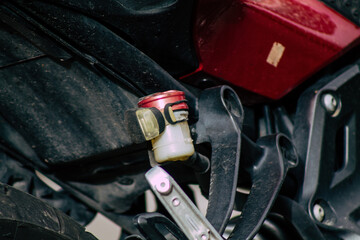 Closeup of a motorcycle parked in the streets of the city center of the metropolitan area
