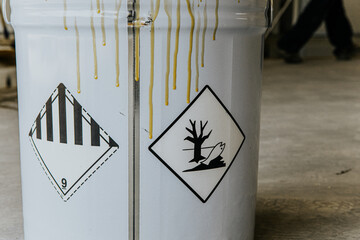 Industrial hall with colored floor, bucket.Epoxy resin applied to the floor.