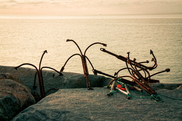 Old rusty anchors on the beach