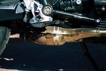 Closeup of a motorcycle parked in the streets of the city center of the metropolitan area
